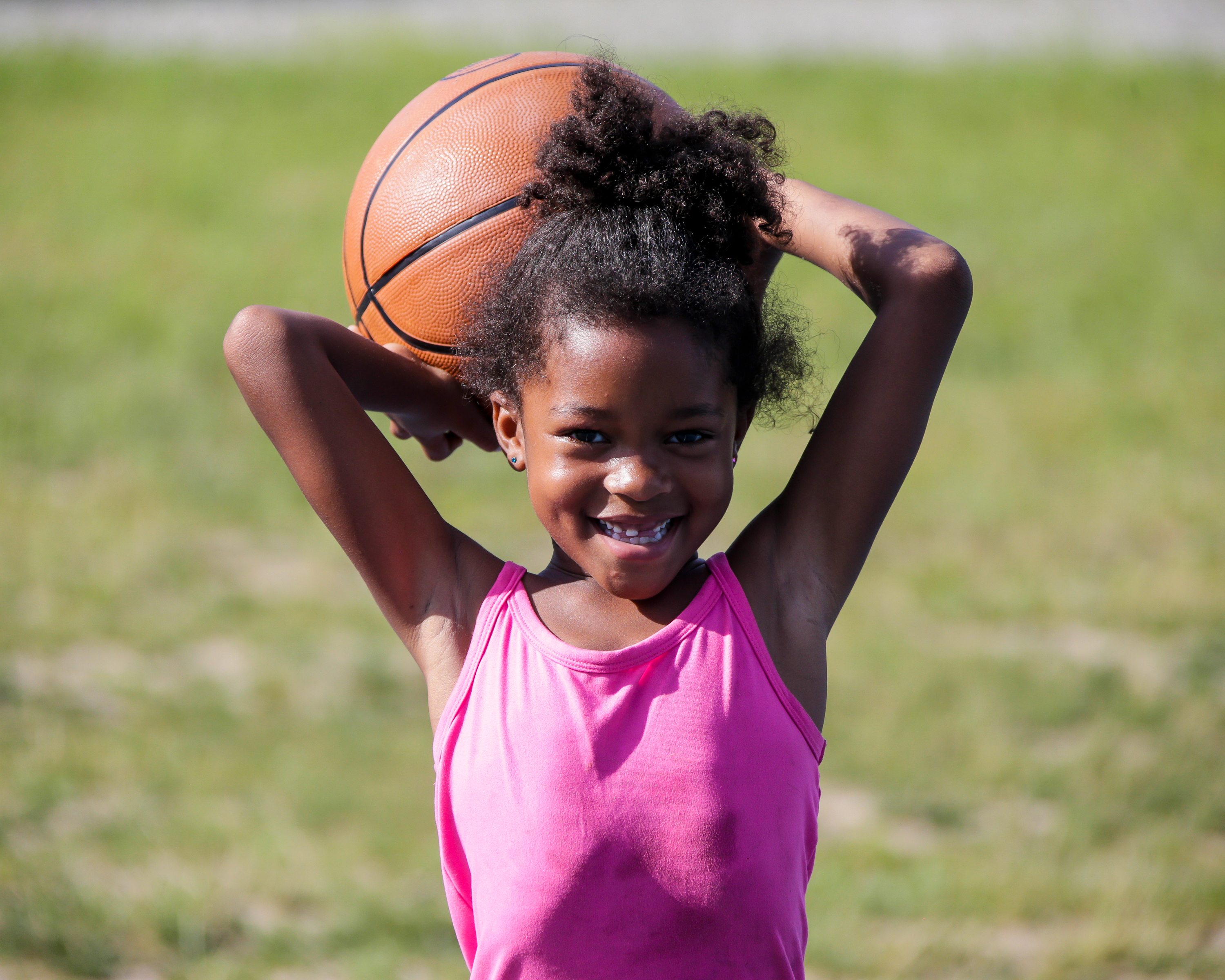 Image of a girl holding a basketball